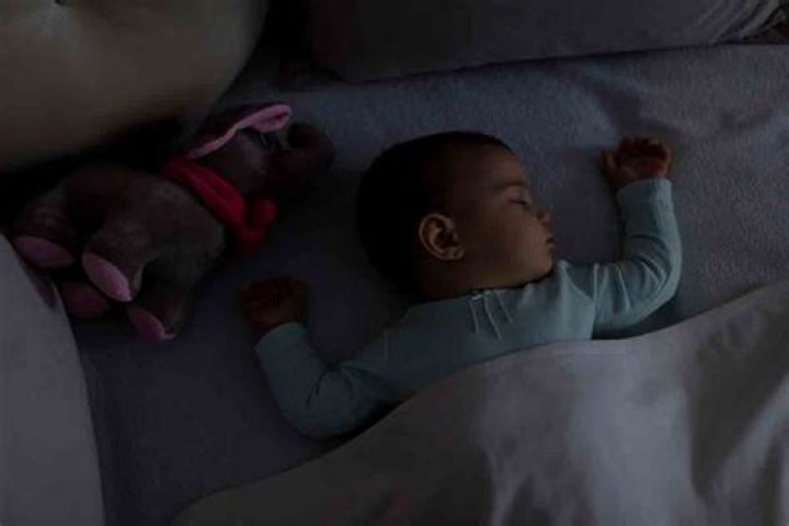 At what age do babies sleep through the night without feeding?