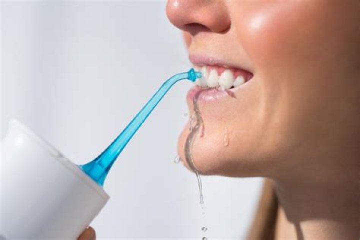 Can I use a Waterpik on a crown?