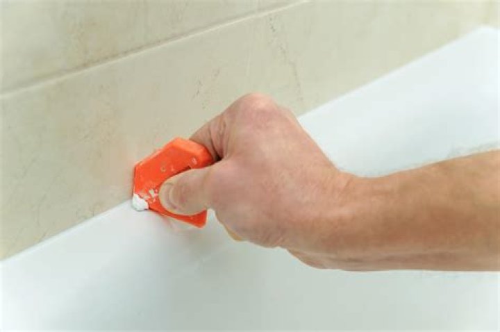 Can I use caulk instead of grout in shower?