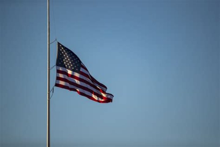 Can you put another flag under the American flag?