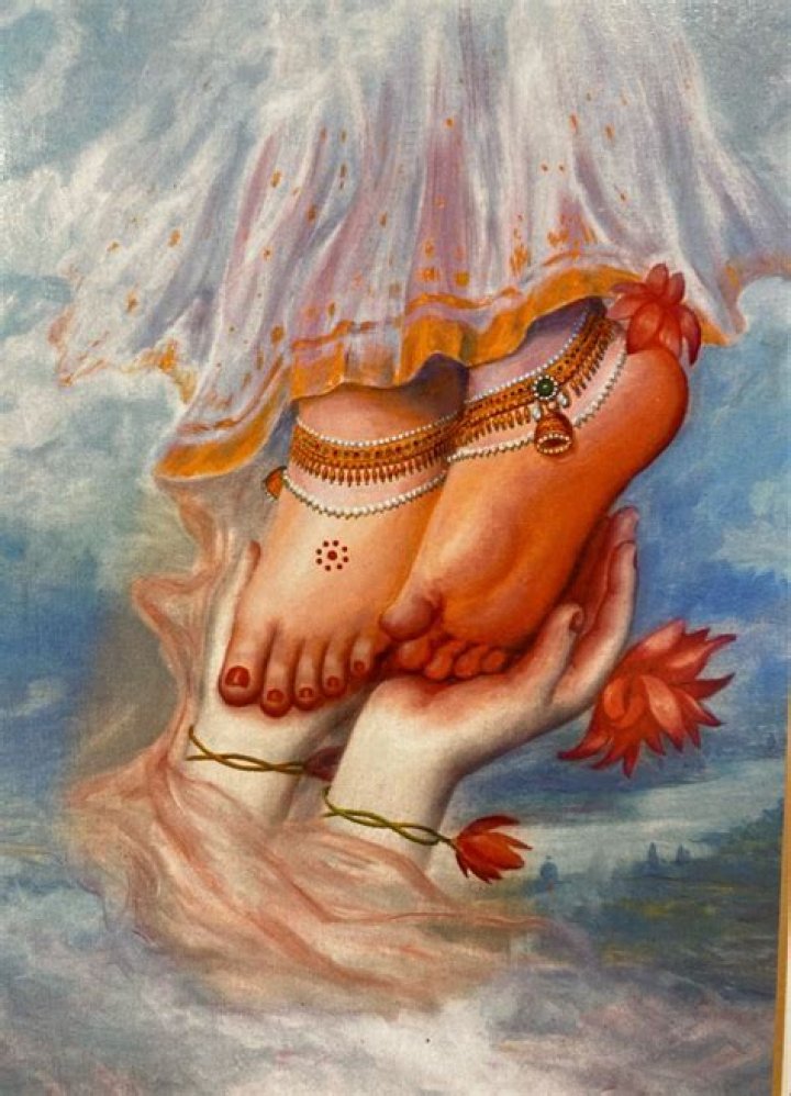 Did Krishna touch Radha's feet?
