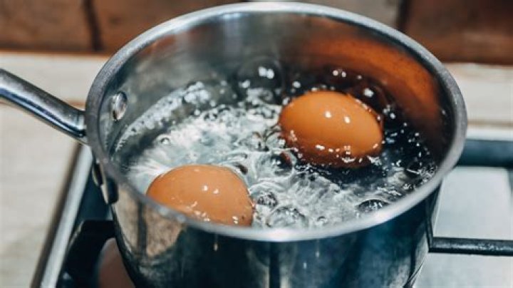 Do you put salt or vinegar in water when boiling eggs?