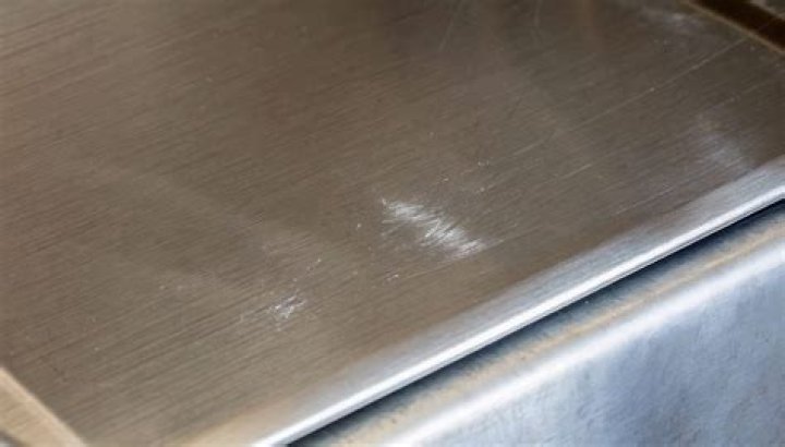 Does WD-40 remove scratches from stainless steel?