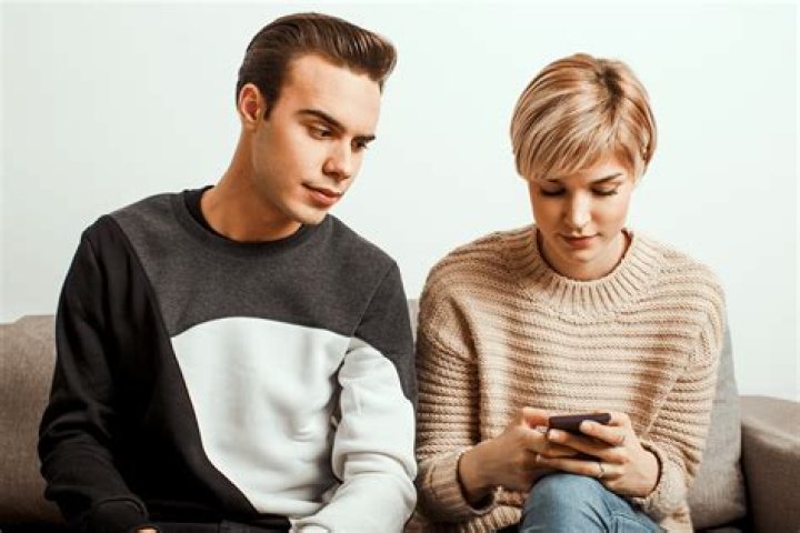 How can I tell if my partner's relationship status is hidden from others on Facebook?