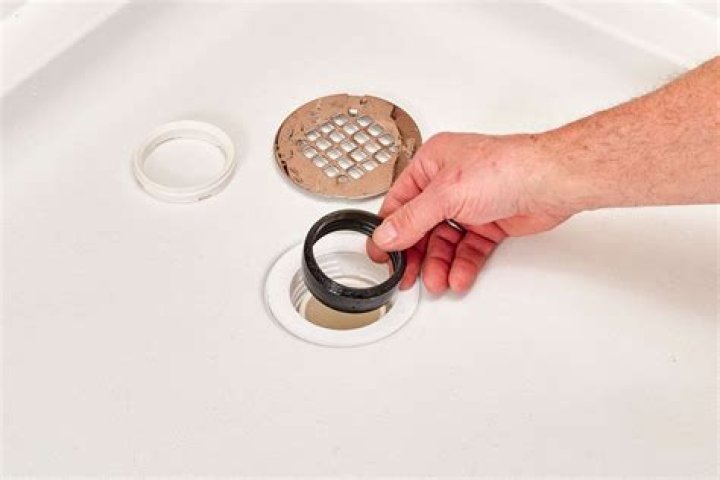 How do I clean my shower drain?