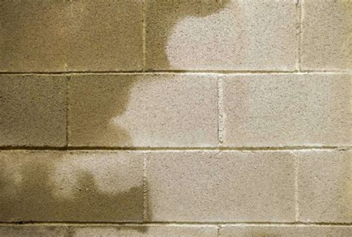 How do I stop water seeping in my basement walls?