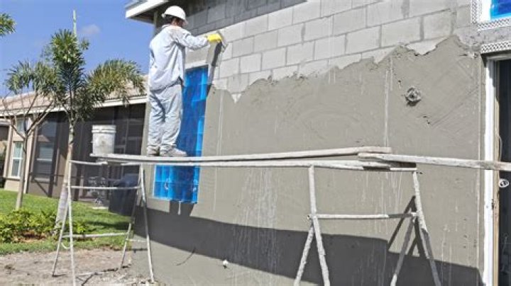 How do you prepare a concrete wall for stucco?