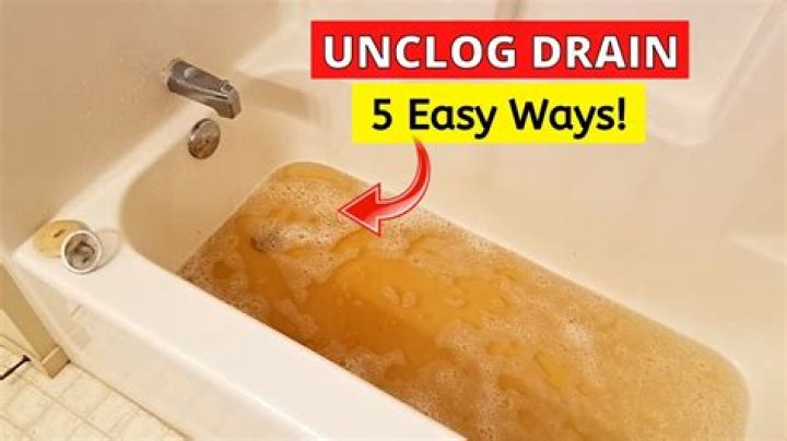 How do you unclog a slow bathtub drain?