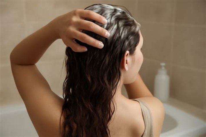 How often should low porosity hair be washed?