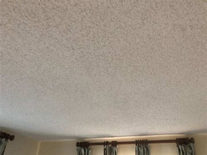 Is it OK to skim coat popcorn ceiling?
