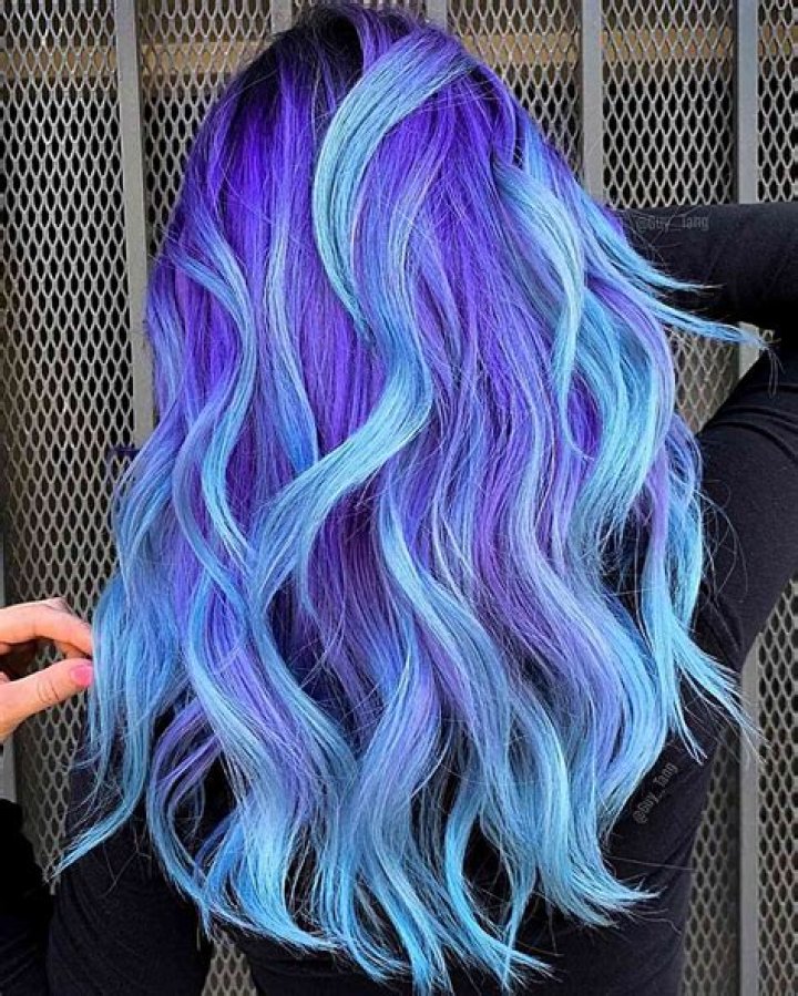 Is Touka's hair blue or purple?