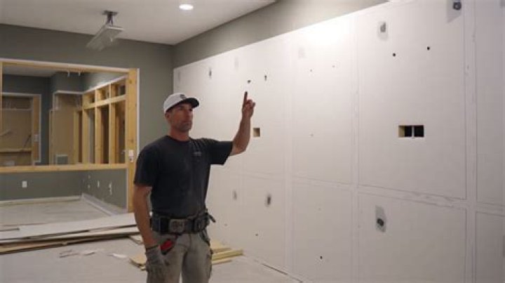 Should I put plastic behind drywall in a basement?