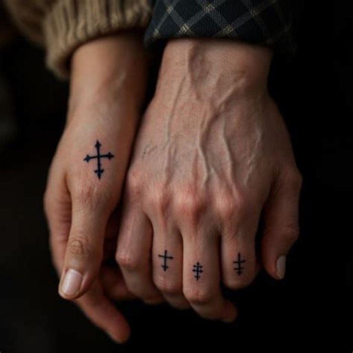 What does a cross tattoo on your hand mean?