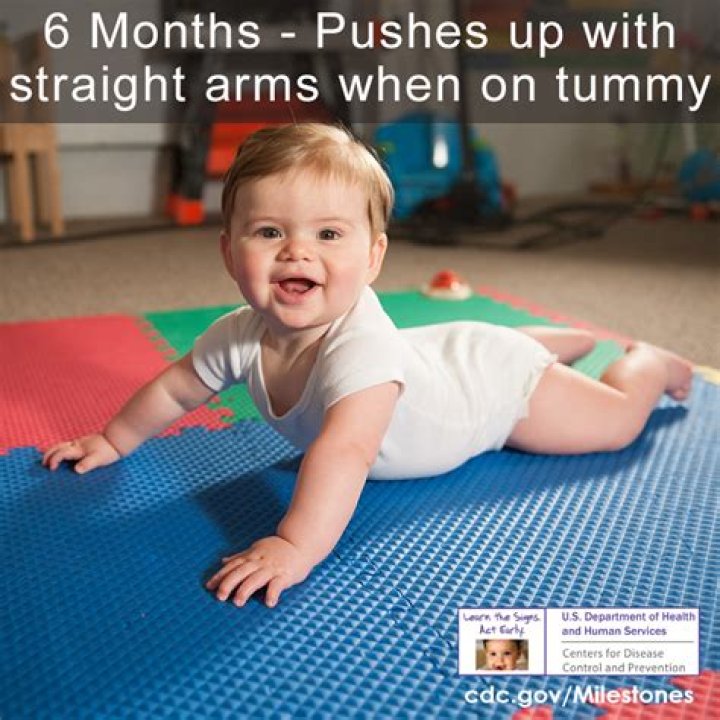 When should baby push up on arms?