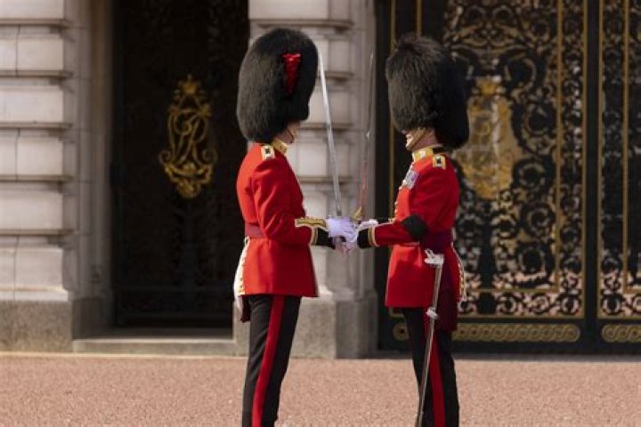 Why are The Queen's guards hats so big?