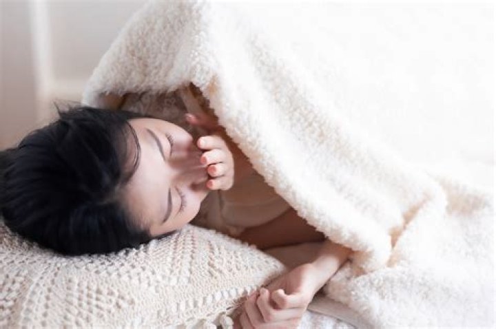 Why do I sneeze in my bedroom?