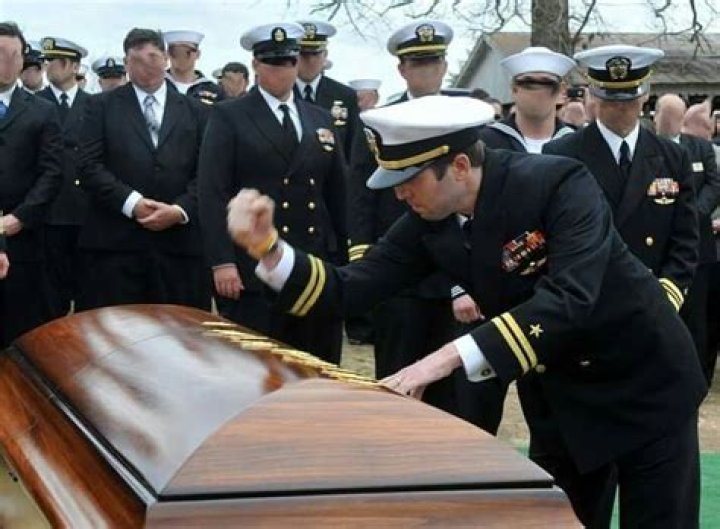 Why do SEALs put Tridents on coffin?