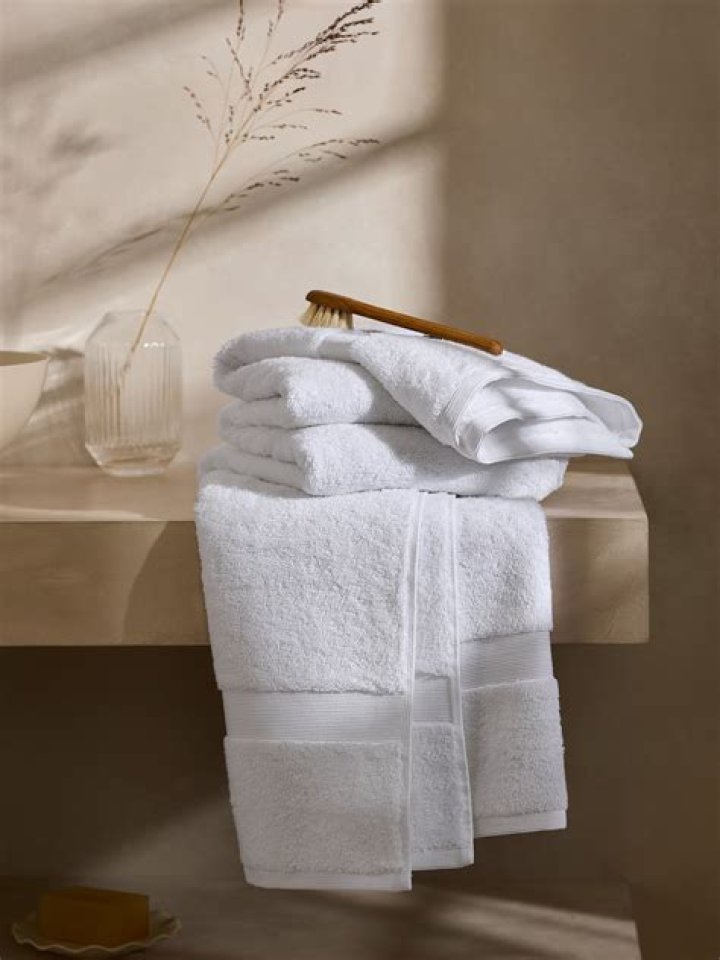 Why do towels go hard in front loader?